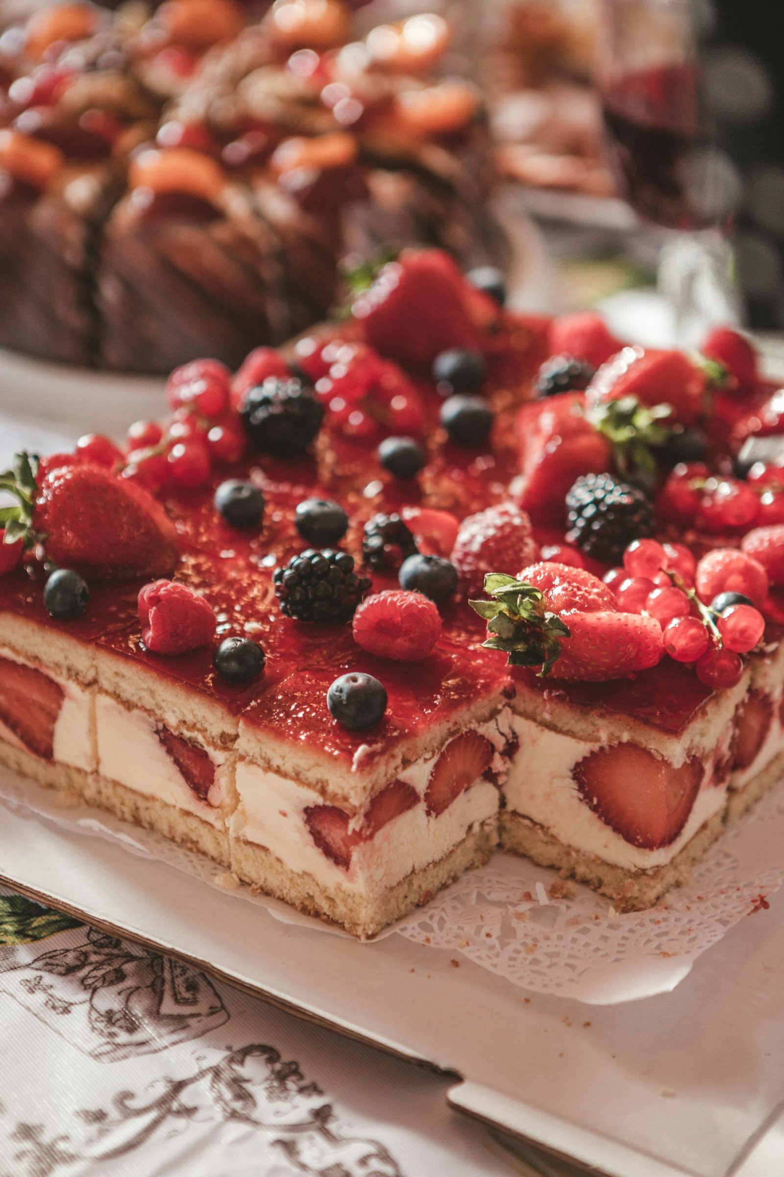 Enticing layered cake topped with fresh berries, perfect for food lovers.
